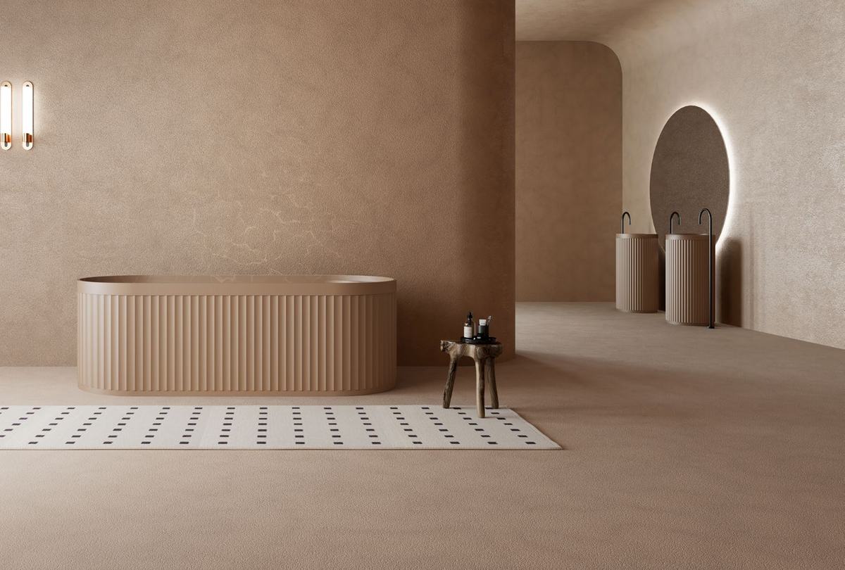 Fluted freestanding bath in a sand-coloured room