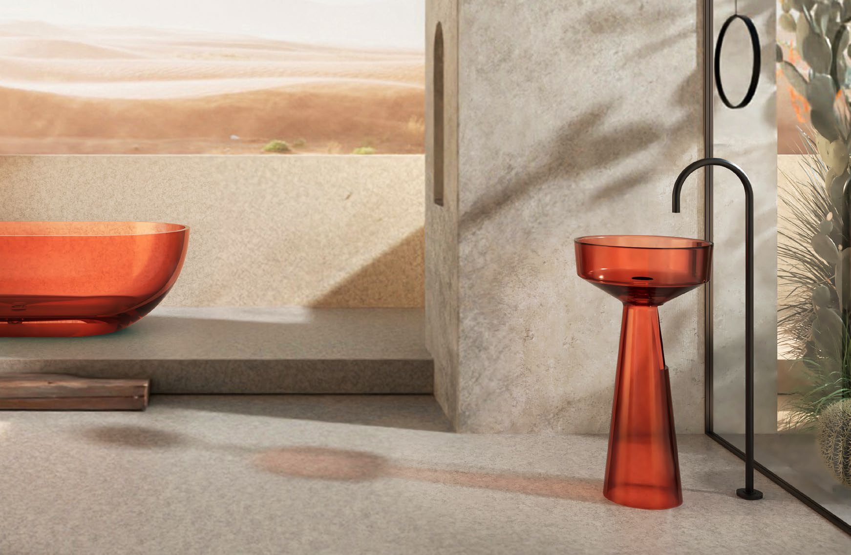 Transparent resin bath and pedestal basin in burnt orange, against travertine